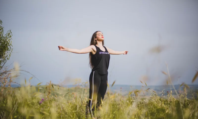 woman-meditating-with-hands-apart_11zon